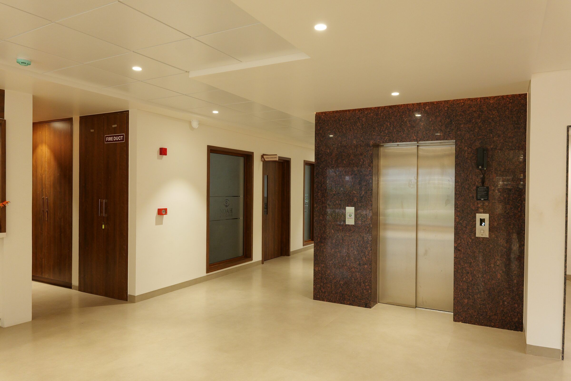 Corridor to the consultation rooms, with a lift